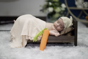 A baby girl comfortably sleeping in a small bed, Lens of Lights Took the photo in UK