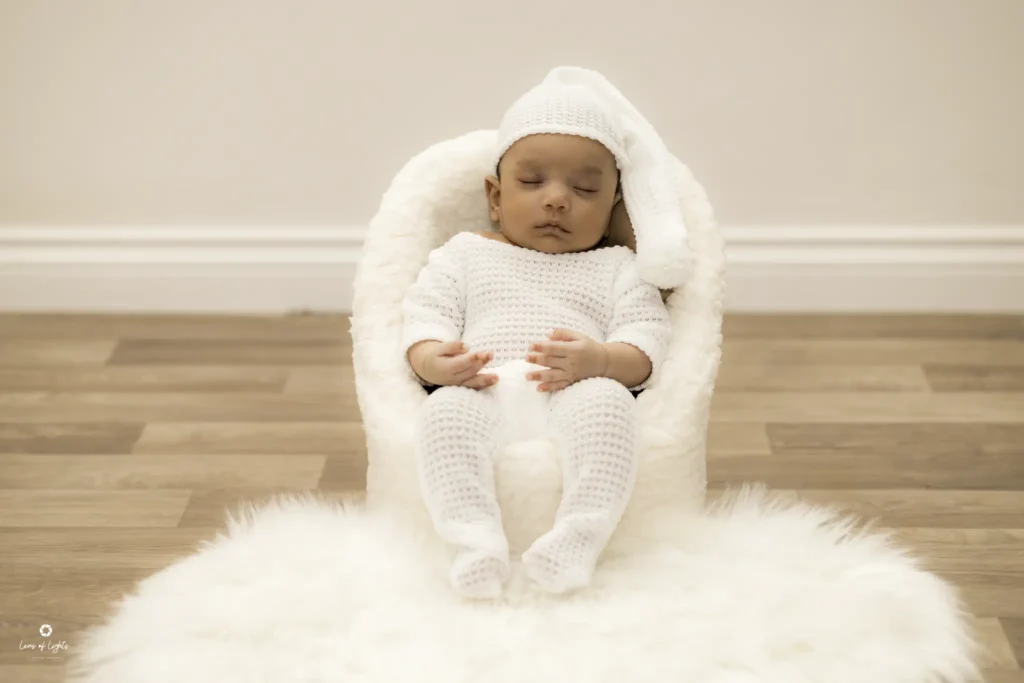 Sitting a boy- this newborn photography taken by Lens of Lights UK